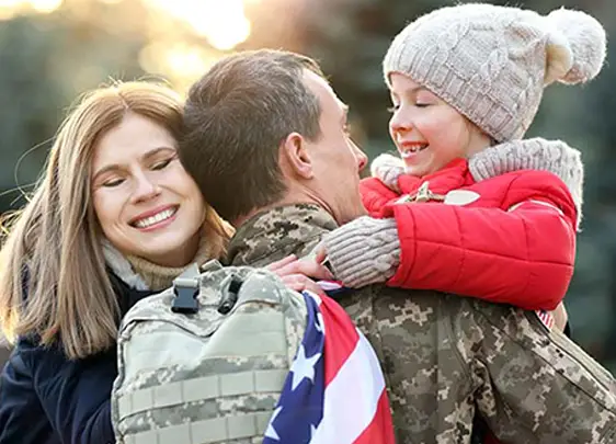 A happy military family in a warm embrace